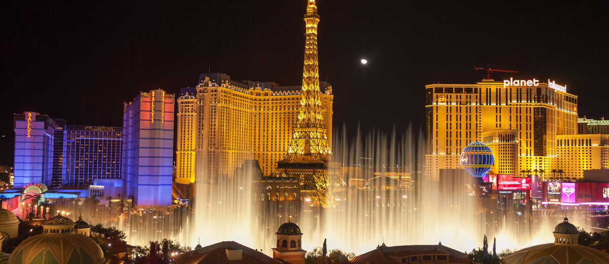 USA. LAS VEGAS - FEB 14 2009: Night view of the dancing fountains of Bellagio and the Eiffel Tower replica of Paris Las Vegas Resort in Las Vegas Nevada, USA